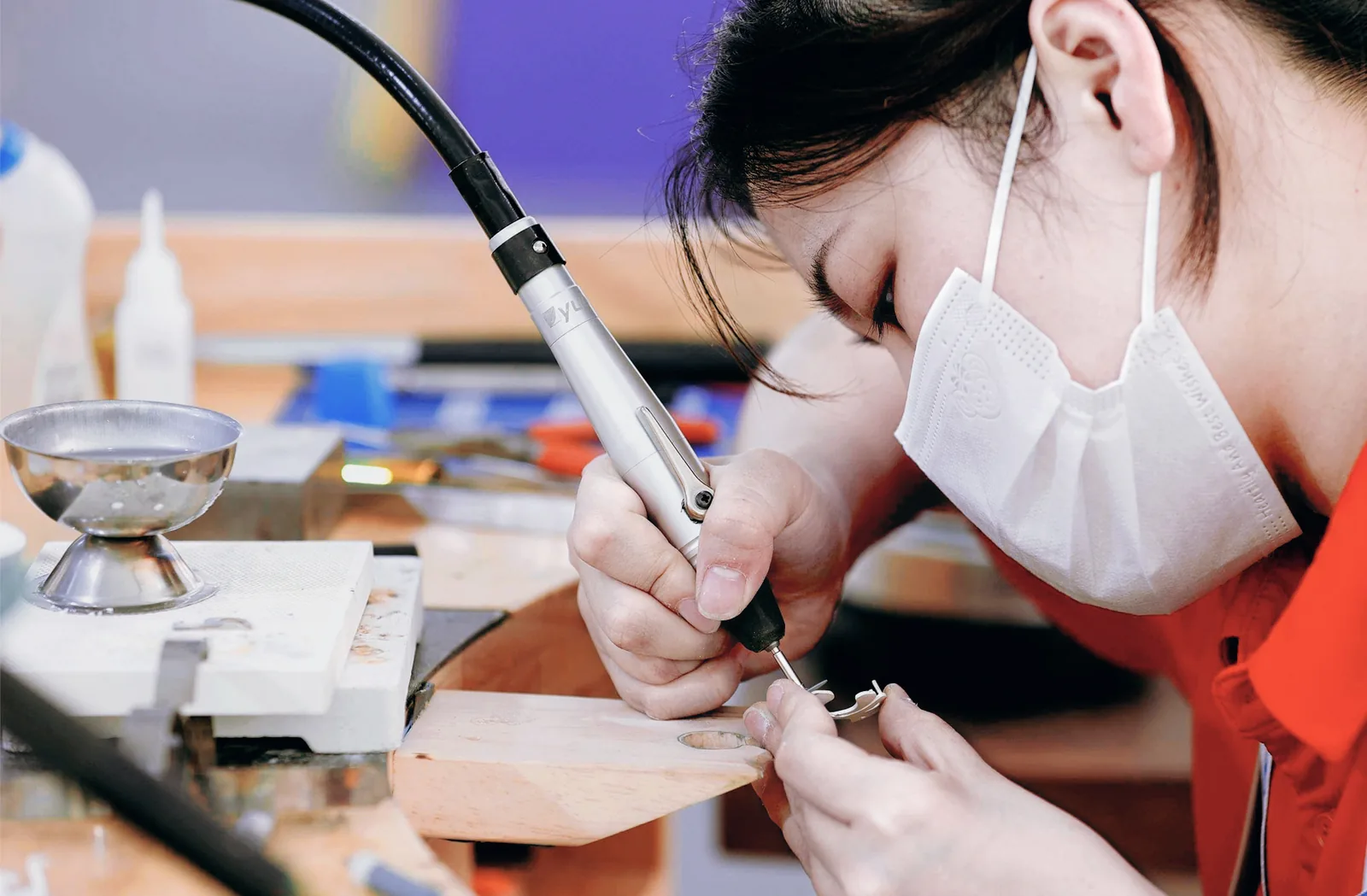 Close view of jewelry finishing by hand