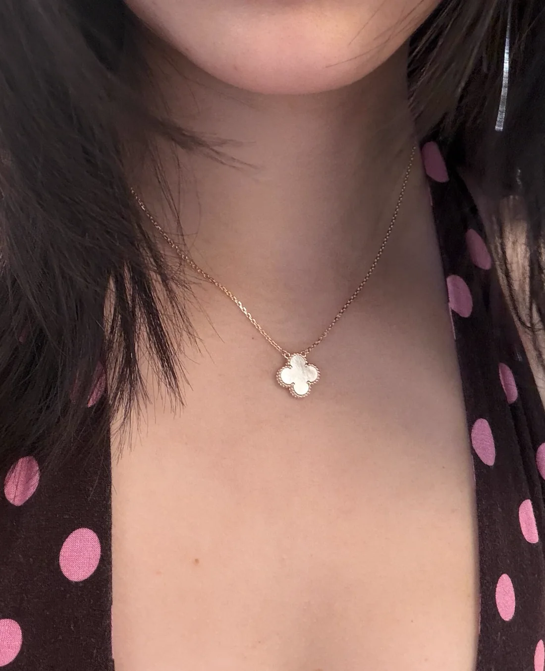 Customer wearing a mother-of-pearl clover necklace